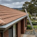 Tiled roof and clear guttering on a Greenway home ahead of storm season, showing roof maintenance greenway preparation work
